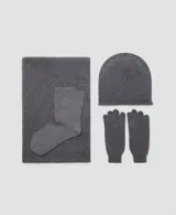 Guantes de punto de cachemira en color gris, con diseño clásico y puño elástico acanalado.