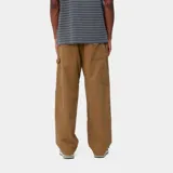 Pantalón negro de lona Marshall, corte holgado y talle regular, con paneles anchos en las rodillas, triple costura, bolsillos para herramientas y presilla para martillo.