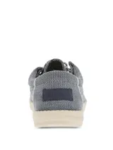 Alpargata Hush Puppies modelo Canyon, color gris con textura tejida. Presenta cordones decorativos y suela de EVA en color crema, diseñada con tecnología ZeroG para mayor ligereza y flexibilidad.