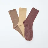 Lote de tres pares de medias de algodón acanaladas con lurex, en color marrón, beige y bordó.