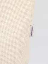 Camiseta de manga corta y cuello redondo con fit relajado, confeccionada en tejido con textura tipo waffle. Diseño básico y versátil.