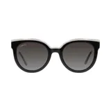 Lentes de sol Lancel con montura gruesa de acetato negro y blanco, con forma cat-eye y lentes grises degradadas.