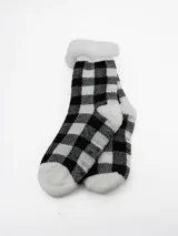 Medias térmicas con interior de sherpa, diseño a cuadros en blanco y negro.