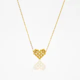 Cadena dorada de acero quirúrgico hipoalergénico con dije de corazón formado por pequeñas esferas doradas.