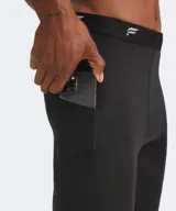 Calza deportiva negra de alto rendimiento, de diseño ajustado y cintura elástica con logo de la marca.
