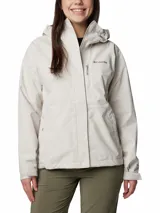 Campera impermeable Columbia modelo Hikebound II, color gris claro, con capucha ajustable, cierre frontal con solapa, bolsillos con cremallera y puños ajustables. Cuenta con tecnología Omni-Tech™ y costuras selladas.