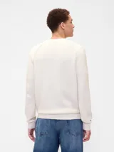 Buzo de punto de algodón con cuello redondo, mangas tipo raglán y puños y ruedo acanalados.