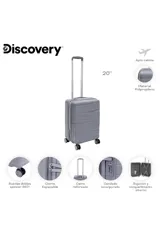 Valija carry on rígida color gris, con diseño texturizado de líneas onduladas, cuatro ruedas multidireccionales y manija telescópica ajustable.