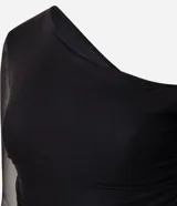 Blusa ajustada de tul negro con diseño asimétrico de un solo hombro. Presenta mangas largas transparentes, fruncido lateral y una aplicación vertical de encaje que aporta textura.