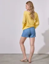 Buzo amarillo tejido en hilado fino, marca Ruby Rd. Manga larga amplia, tejido calado. Terminación de ruedo con nudo.