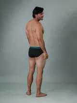 Pack de tres slips de algodón color gris oscuro con cintura elástica con el logo de Calvin Klein en celeste, fucsia y gris.