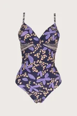 Malla enteriza de color azul marino con estampado de formas abstractas y flores en tonos lilas y beige. Presenta diseño corsetero con escote en V cruzado y tirantes finos regulables.