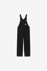 Mameluco Carhartt WIP modelo Bib Overall, de color negro, con múltiples bolsillos frontales, tirantes ajustables con hebillas metálicas y el parche con el logotipo de la marca en el bolsillo del peto.