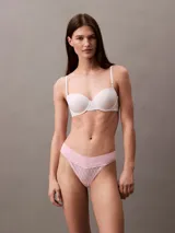 Colaless de encaje rosado con cintura elástica con logo Calvin Klein.