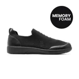 Championes deportivos Korium modelo Idelia de color negro, sin cordones, con tejido de punto respirable y refuerzos sintéticos en la puntera y el talón. Cuenta con plantilla con tecnología Memory Foam.