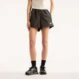 Short New Balance de mujer modelo Trackside, color gris oscuro, con cintura elástica y ribetes contrastantes en los laterales. Presenta el logo de la marca bordado en la pierna izquierda.