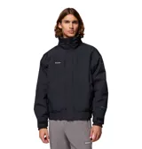 Campera técnica Columbia modelo Bugaboo II 1986, de color negro, con tecnología Omni-Tech impermeable y transpirable. Presenta cuello alto, cierre frontal con tapeta, puños ajustables con velcro y dobladillo elástico. Es un diseño 3 en 1 que incluye forro polar interior desmontable.