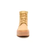 Bota de cuero color miel con plataforma alta y suela dentada. Presenta cordones al tono, cuello acolchado en color marrón oscuro y logo de la marca grabado en el lateral.