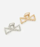 Set de dos pinzas para el pelo de metal, una plateada y otra dorada, con diseño geométrico de lazo.