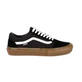 Championes Vans modelo Skate Old Skool, de color negro con la icónica banda lateral blanca y suela de goma color caramelo. Presentan un diseño clásico de perfil bajo con cordones blancos y etiqueta de tablero de ajedrez en el lateral.