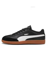 Championes Puma modelo 9T, color negro con franja lateral blanca y suela de goma marrón estilo gum, con puntera de gamuza.