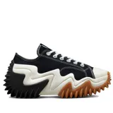 Championes Converse Run Star Motion de corte bajo, con capellada de lona de algodón orgánico en color negro. Presentan una entresuela de plataforma voluminosa con diseño ondulado y una suela dentada de goma en color blanco, negro y suela.