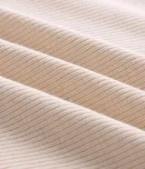 Remera polo de manga larga Marfinno en color beige, confeccionada en algodón con textura acanalada, cuello camisero con botones y diseño clásico.