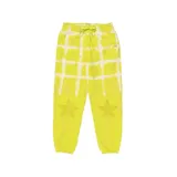 Pantalón de jogging amarillo con estampado de cuadrados y estrellas en blanco, con cintura elástica ajustable con cordón.