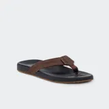 Ojotas Reef Cushion Phantom, con base negra y tira de cuero marrón.