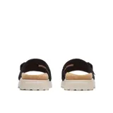 Sandalia tipo slide de la marca Merrell, con capellada de cuero negro y correa ajustable con hebilla. Presenta una plantilla revestida en corcho y una entresuela de espuma de plataforma en color crema.