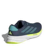 Championes Adidas Supernova Stride 2 para hombre, ideales para running y entrenamiento. Color azul con detalles en verde y amarillo. Cuentan con tecnología Dreamstrike+ en la mediasuela y suela ADIWEAR.