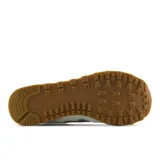 Championes urbanos New Balance modelo 515, color beige con detalles de animal print de leopardo en el logo lateral y el talón. Confeccionados con malla transpirable y refuerzos de gamuza sintética, cuentan con entresuela de espuma EVA para mayor amortiguación y suela de goma.