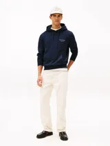 Buzo con capucha y bolsillo canguro Tommy Hilfiger de color azul marino, con cordones ajustables, puños y bajo acanalados, y pequeño logo bordado en el pecho.