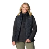 Chaleco Columbia Heavenly II Vest Omni-Heat color negro, con diseño acolchado de líneas diagonales, cierre frontal y bolsillos laterales con cierre. Incluye la tecnología Omni-Heat para retener el calor corporal y Omni-Shield para repeler la humedad.