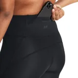 Calza deportiva Under Armour negra, capri, con cintura alta y perforaciones en la parte inferior de las piernas.