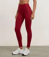 Legging deportiva Get Over de tiro alto, confeccionada en microfibra elástica, con bolsillos laterales funcionales y largo hasta el tobillo.