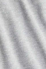 Pantalón de punto waffle con cintura elástica, cordón ajustable y piernas amplias de corte recto.