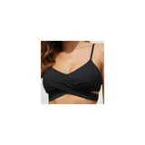 Conjunto de bikini de dos piezas de la marca Uniteduy, compuesto por un crop top amarillo liso con diseño cruzado y tirantes finos, y una bombacha de tiro alto con estampado floral y de hojas en tonos amarillos, verdes y blancos.