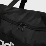 Bolso deportivo Adidas Linear negro con logo blanco. Tiene doble asa de mano, correa de hombro ajustable, compartimento principal con cierre y bolsillos laterales con cierre.