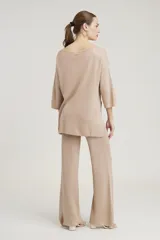 Pantalón de lurex rojo de corte palazzo.