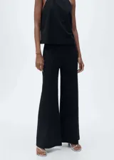 Pantalon palazzo de tiro alto con cintura elástica, confeccionado en tejido de algodón, poliamida y lino.