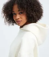 Buzo de algodón con felpa, color bordó, con capucha estructurada, bolsillo canguro delantero y puños canelados.