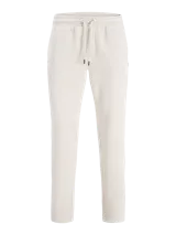 Pantalon de buzo color beige, corte recto, confeccionado en tejido de algodón con cintura elastizada.