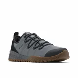 Championes Columbia Fairbanks Low de senderismo, color gris con detalles en negro y suela de goma color marrón. Presentan parte superior de malla transpirable con refuerzos en el talón y puntera, entresuela TechLite para amortiguación y suela Omni-Grip para mayor tracción.