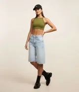 Blusa sin mangas de Blue Steel, confeccionada en tejido rib con textura acanalada. Presenta un diseño ajustado al cuerpo con cuello halter que resalta los hombros.