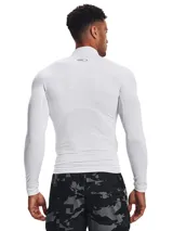 Remera térmica de compresión Under Armour con cuello alto, manga larga y diseño ergonómico. Confeccionada en tejido de doble capa con interior cepillado y paneles de malla elástica para ventilación estratégica.
