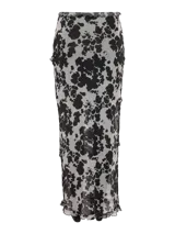 Pollera larga de tiro alto con estampa animal print tipo vaca, confeccionada en tejido liviano y fluido. Presenta un tajo frontal con detalle de volados en los bordes.