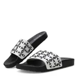 Chancletas Tiffosi modelo Boots Cruz, con base negra y tira ancha blanca con estampado geométrico en negro.
