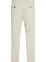 Pantalón de algodón elástico color crema con estampado integral de monogramas TH tonales en jacquard. Tiene dos bolsillos abiertos en la cadera y dos bolsillos traseros con botón.