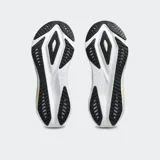 Championes de running Asics Versablast 4, color negro con detalles en naranja y suela blanca con tecnología AmpliFoam+. Diseño ligero y reactivo para entrenamiento versátil.